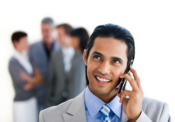 Focus on a smiling businessman on phone