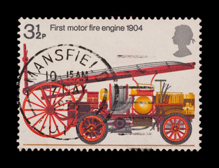 Fototapeta na wymiar znaczek poczty featuring pierwszy wóz strażacki silnikowy