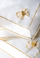 White fabric napkins with ribbon bow for table decoration