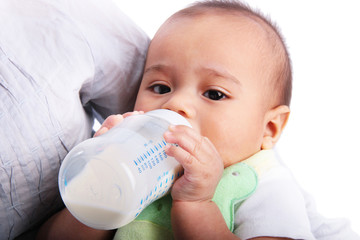 Baby drinking milk from a bottle