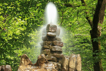 Fototapeta na wymiar Stone fountain in wood