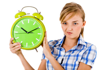 Girl giving funny expression and holding the alarm