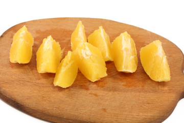 slice circle of sweet tasty orange - isolated on wooden  board