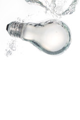 A light bulb falling in clear water