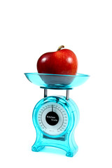 apple on a kitchen scale - diet concept