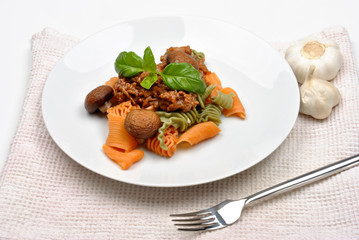 home made pasta with mince sauce and basil