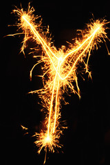 Letter Y made of sparklers isolated on black