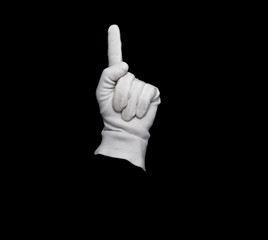 A white gloved hand isolated on black background
