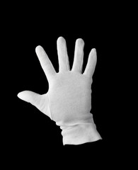 A white gloved hand isolated on black background