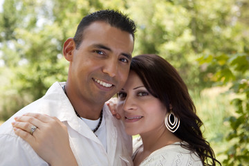 Naklejka premium Attractive Hispanic Couple in the Park