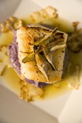 Sea bass on a bed of purple potato puree