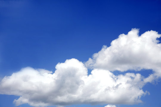 White fluffy soft clouds in blue sky