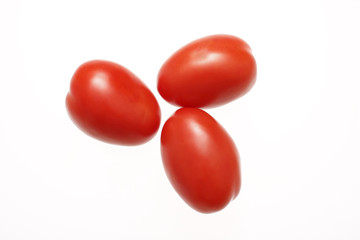 Fresh roma tomatoes isolated on white.