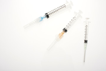 Assorted syringes on a table.