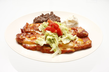 Plate of enchiladas and refried beans