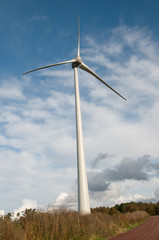 Fototapeta premium Wind energy infrastructure in rural countryside landscape