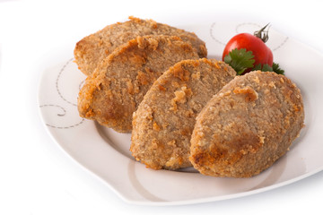 Cutlet with parsley and tomato