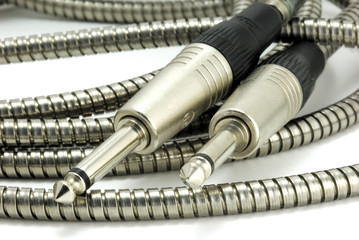two guitar plug-in jacks and cable