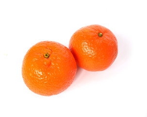 two ripe tangerine on white