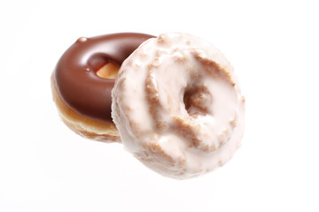 Chocolate donut and frosted donut isolated on white.