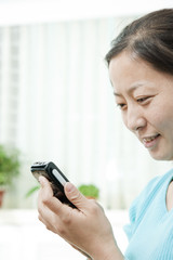 Woman Looking at Cell Phone