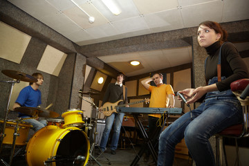 Fototapeta na wymiar a rock band is working in studio. practice pause