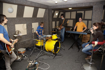 Fototapeta na wymiar thoughtful rock band. musicians working in studio.