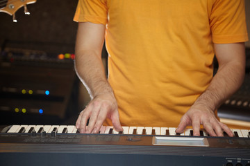 keyboard player is working in studio