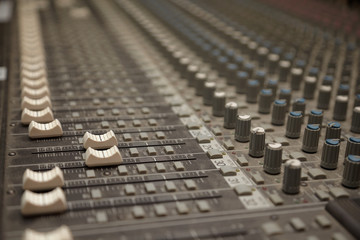 Fototapeta premium faders of dusty sound mixer. two faders in focus