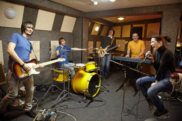 a rock band working in studio. the joy of creation
