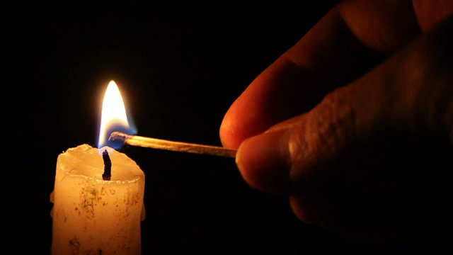 Candle on a black background 