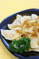 Cabbage dumplings with fried onion