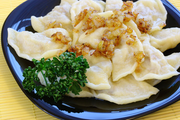 Cabbage dumplings with fried onion