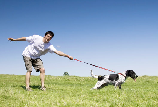 Man Playing With His Dog