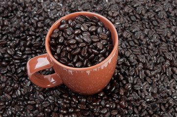 Coffee mug full of beans