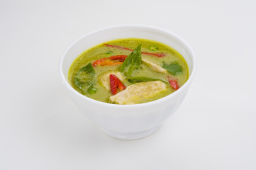 green curry in a white bowl