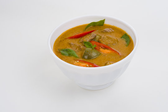 red curry in a white bowl