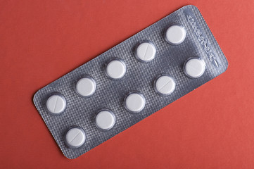 Tablet on red closeup