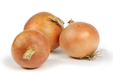 three onions closeup white background