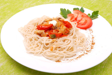 plate of spaghetti with mushrooms and tomatoes