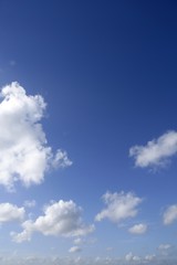 Naklejka na ściany i meble Blue sky white clouds in a summer clean day, nature