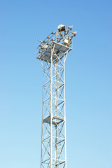 Industrial light against blue sky