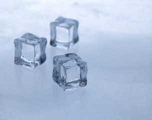 Ice cubes on the cool background. Abstract