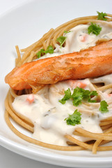 salmon steak with home made spaghetti and parsley