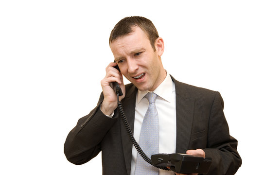Angry man phoning on white background