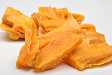 natural dried organic mango and a white background