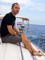 Young man thinking and looking away