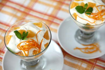 Yogurt dessert with mint and oranges
