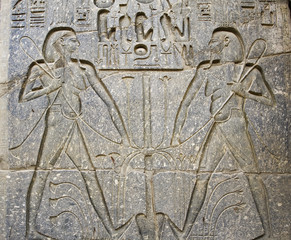 Hieroglyphic carvings on a wall