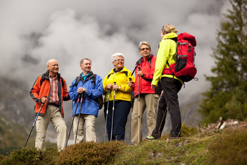 female hiking guide with happy seniors